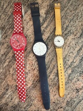 Swatch watches a set of 3 plus a free one that needs a band.. all needs battery.